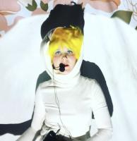 woman in white outfit with yellow hair