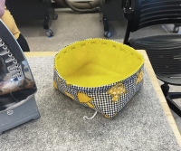 A yellow cloth basket.