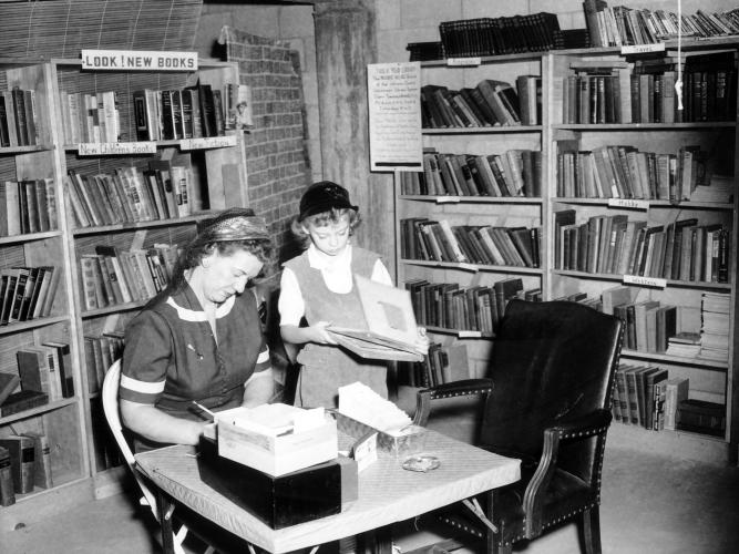Prairie Village Volunteer Library Mrs. Wilson Redman and daughter Judy Redman Mayer in Prairie Village Volunteer Library circa 1954