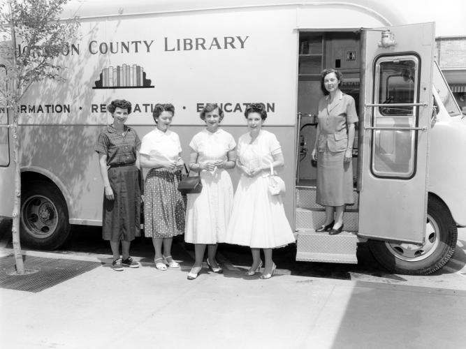 Women by Bookmobile Bookmobile with Betty Wilson, Kay Robeson, Mrs. Richard Haggeman, first Friends President Sally May, and first County Librarian Miss Shirley Brother in 1956