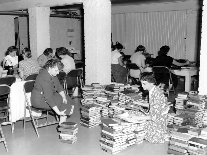 Working at the Lenexa Volunteer Library A group of women sorting and cataloging books at the Lenexa Volunteer Library, 1954. Front Center is Mrs. Wilson E. Redman.