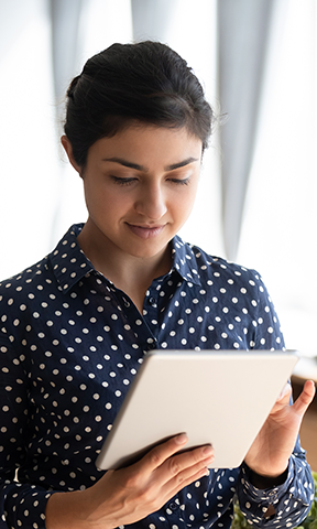 A woman reading an eBook on her tablet