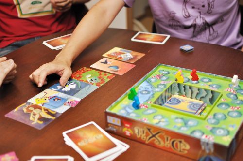 a table with a game of Dixit in progress