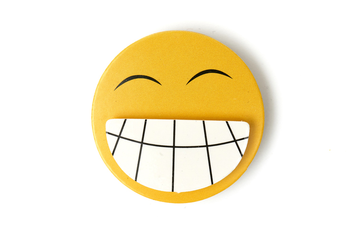 Smiling face icon with a big toothy grin