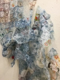 Sculptural, multi-media textile wall hanging.
