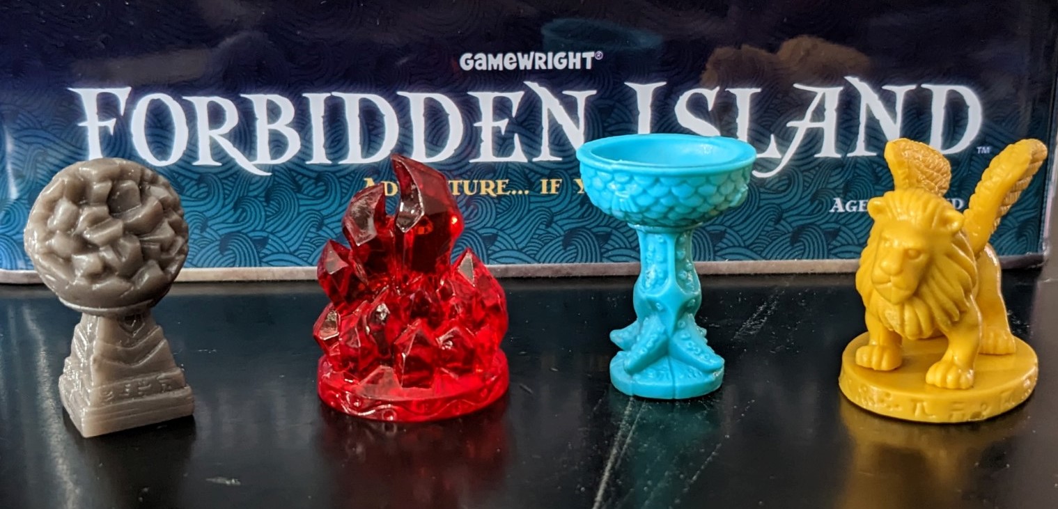 Close-up of the four treasures from Forbidden Island
