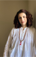 Photo of woman leaning against a wall