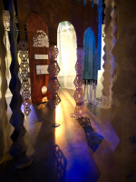 Colored light passing through textile hanging art exhibit