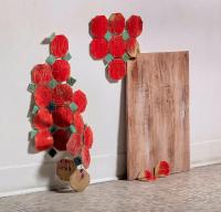 Octagonal and diamond shaped stoneware tiles in red and green wall display. 