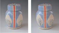 Stoneware jar in light blue with pastoral images.