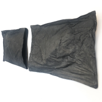 Three dimensional wall sculpture of pillows in dark graphite