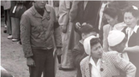 Past Is Prologue: Japanese Internment Camps A black and white photo of people standing in line