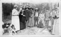  Photo of 4 Native Americans with 6 visitors and a dog