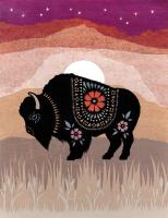 Paper cut piece of decorated bison with a prairie sunset background.