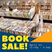 A woman shops for books at a Friends of the Library book sale