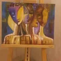 Abstract painting of multiple faces with multi color background.