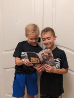 Xavier and Luca with the book, Discovering My Dyslexia Superpowers
