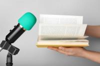 A book held up to a microphone