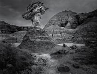 Black and white photograph of rock formations in Badlands National Park.