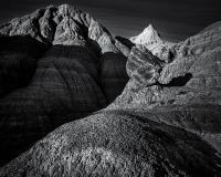 Black and white photograph of rock formations in Badlands National Park.