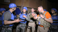 Bend Sunds (in orange shirt) on a UN mission trip to Mali with a Chinese Army unit.