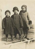 Three young boys in winter clothing