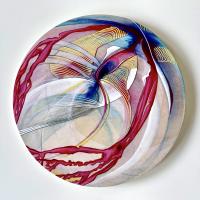 Watercolor of abstract floral on a round canvas.