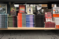 Photograph of stacked books on a shelf