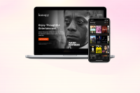 Photo of a laptop and smart phone displaying the Kanopy movie catalog.