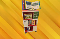 Photo of a rolling book display cart with career and finance books.
