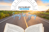 Collage photo of an open book with a road leading into the distance with the JoCoLibrary Uncovered logo setting on the tree-lined horizon.