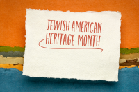 Text Jewish American Heritage Month on torn paper.