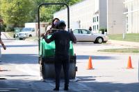 One of the Library makers on a steamroller