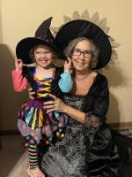 A woman and girl dressed like witches