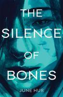 The Silence of Bones by June Hur. Behind text is a moody blue water color portrait of a girl look down, with dark hair framing her face. 
