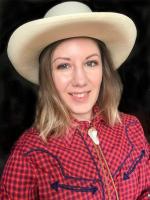 Lauren Loya Blond woman in a red checkered shirt with a tan cowboy hat