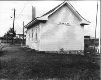 a black and white image of a small building--the original Shawnee location