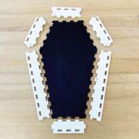 image of laser cut coffin pieces laid out